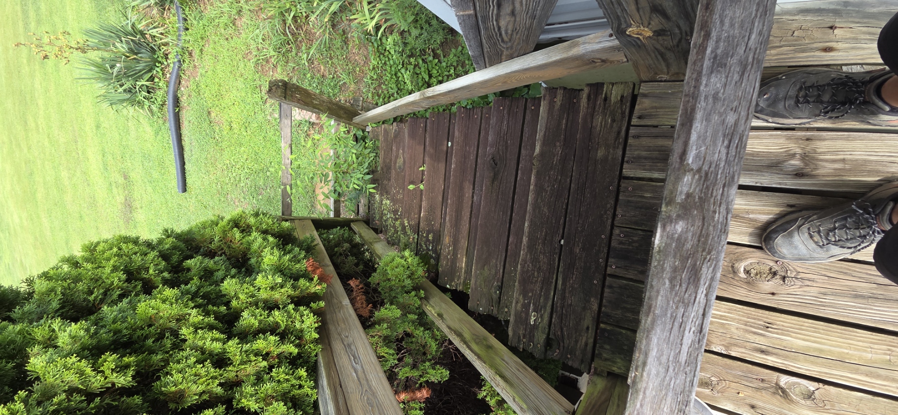 View down the original weathered deck stairs before replacement