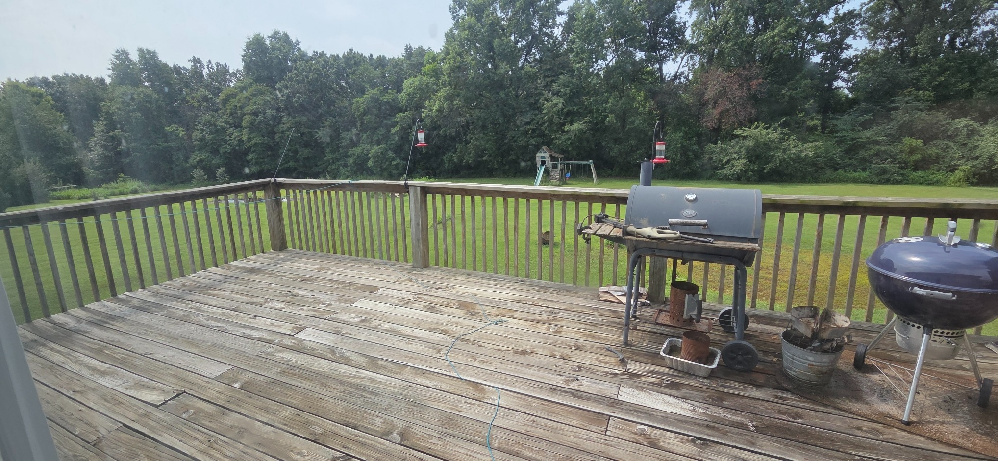 Original deck surface with weathered and split boards