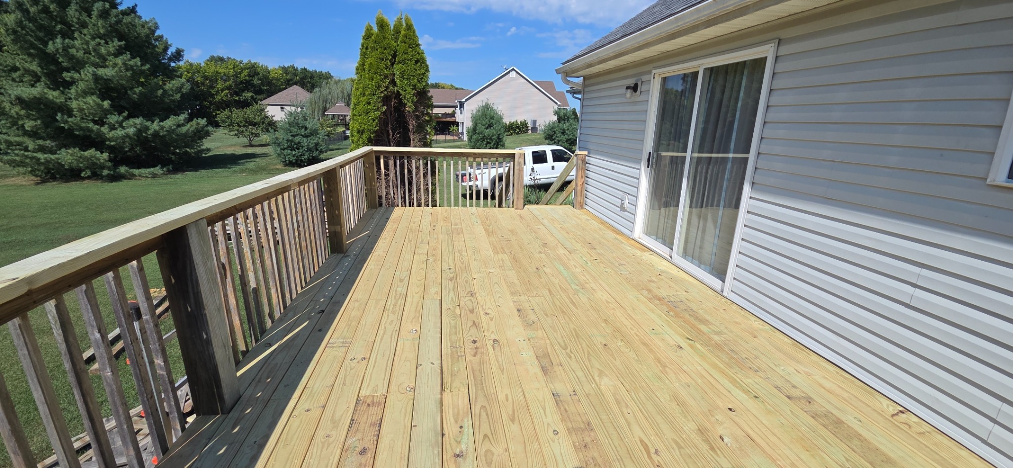 Deck surface after replacement with new wood boards